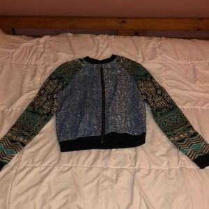 Zip up long sleeve shirt.